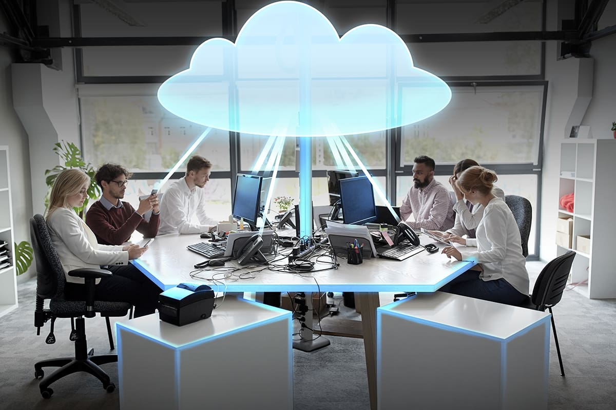 business team with cloud computing hologram above it